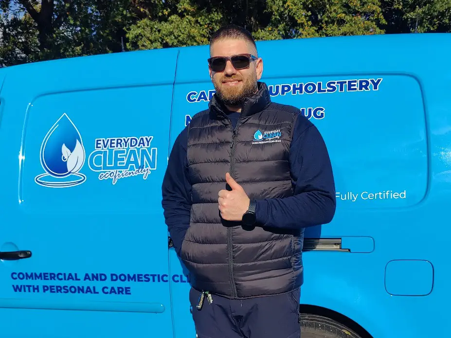 01 (1) professional upholstery cleaner posing in front of a van